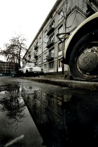 Pentax K10D, Sigma 10-20mm wide angle zoom lens. Volkswagon Beatle with a flat tyre, in a rundown area of Warsaw, Poland. 